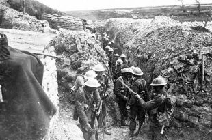 On the morning of 1st July 1916 men of the 1st Lancashire Fusiliers fix bayonets before proceeding to the front line. (Copyright © IWM Q744)